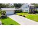 Lovely home with well-maintained landscaping, spacious driveway, and a detached two-car garage at 708 32Nd W St, Bradenton, FL 34205