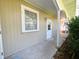 Inviting exterior walkway featuring a well-lit passage with manicured landscaping leading to the entrance at 708 32Nd W St, Bradenton, FL 34205
