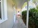 Inviting walkway leading to the entrance with manicured landscaping and a welcoming doormat at 708 32Nd W St, Bradenton, FL 34205