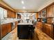 Spacious kitchen boasts an island with granite countertops and wood cabinets, perfect for cooking and entertaining at 708 32Nd W St, Bradenton, FL 34205