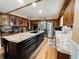 Modern kitchen features a large island with granite countertops, stainless steel appliances, and ample storage space at 708 32Nd W St, Bradenton, FL 34205