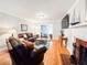 Cozy living room with hardwood floors, a fireplace, and stylish furnishings at 708 32Nd W St, Bradenton, FL 34205