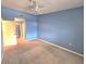 Comfortable bedroom with wall-to-wall carpet features a closet and access to the hallway at 7201 29Th Avenue W Dr # 306, Bradenton, FL 34209