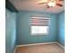 Comfortable bedroom with a window, carpet, and modern ceiling fan at 7201 29Th Avenue W Dr # 306, Bradenton, FL 34209
