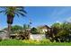 Community sign with manicured landscaping, palm trees, and clear blue skies showcases property at 7201 29Th Avenue W Dr # 306, Bradenton, FL 34209