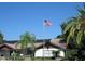 Community clubhouse exterior with solar panels, showcasing well-maintained landscaping at 7201 29Th Avenue W Dr # 306, Bradenton, FL 34209