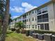 Well-maintained building exterior with lush landscaping and cooling units neatly arranged at 7201 29Th Avenue W Dr # 306, Bradenton, FL 34209