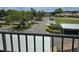 Balcony view overlooking a well-maintained parking area and lush landscaping provides a serene setting at 7201 29Th Avenue W Dr # 306, Bradenton, FL 34209