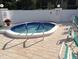 Relaxing hot tub surrounded by a patio area, creating a serene spa-like experience at 7201 29Th Avenue W Dr # 306, Bradenton, FL 34209
