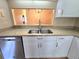 Modern kitchen featuring stainless steel appliances, white cabinets, and light countertops at 7201 29Th Avenue W Dr # 306, Bradenton, FL 34209