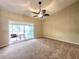 The living room features wall-to-wall carpeting and sliding doors to a screened lanai at 7201 29Th Avenue W Dr # 306, Bradenton, FL 34209