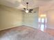 The living room features wall-to-wall carpeting and doorway to hall and front entry at 7201 29Th Avenue W Dr # 306, Bradenton, FL 34209