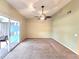 The living room features wall-to-wall carpeting and sliding doors to the screened lanai at 7201 29Th Avenue W Dr # 306, Bradenton, FL 34209