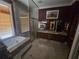 Bathroom with marble tile, shower, soaking tub and large vanity at 7732 N Mobley Rd, Odessa, FL 33556