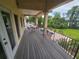 Outdoor deck featuring a sitting area and a view of the lush backyard at 7732 N Mobley Rd, Odessa, FL 33556