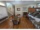 Dining room with hardwood floors and natural light with stairs nearby at 7732 N Mobley Rd, Odessa, FL 33556