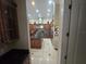 View into kitchen featuring custom cabinets, granite countertops, and a large center island at 7732 N Mobley Rd, Odessa, FL 33556