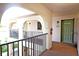 Balcony and front door of condo unit, with security features at 802 Capri Isles Blvd # 231, Venice, FL 34292