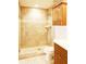 Bathroom includes tiled walk-in shower, vanity, sink, and wooden cabinet storage, seamlessly combining luxury and function at 802 Capri Isles Blvd # 231, Venice, FL 34292