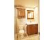 Bathroom featuring a vanity, sink, and a toilet offering a clean and functional space at 802 Capri Isles Blvd # 231, Venice, FL 34292