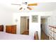 Bedroom with wood floors and hallway view at 802 Capri Isles Blvd # 231, Venice, FL 34292