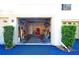 Open garage space with ample storage, shelving, and workspace potential, offering practical functionality at 802 Capri Isles Blvd # 231, Venice, FL 34292