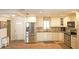 Kitchen area with stainless steel refrigerator, oven and range, and microwave at 802 Capri Isles Blvd # 231, Venice, FL 34292