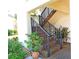 Staircase leading up to condos with nicely landscaped garden area at 802 Capri Isles Blvd # 231, Venice, FL 34292