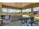 Community pavilion featuring picnic tables, BBQ counters and play area for outdoor recreation at 8541 Whispering St, Sarasota, FL 34240