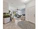 Inviting living room showcasing stylish decor, fish tank, and a seamless transition to the outdoors at 8541 Whispering St, Sarasota, FL 34240