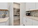 Walk-in pantry with organized shelving, adjacent to the kitchen at 8541 Whispering St, Sarasota, FL 34240