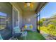 Inviting screened lanai with comfortable seating and view of the landscaped backyard at 8541 Whispering St, Sarasota, FL 34240