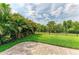 View of the well manicured backyard showing grass and fencing at 10708 52Nd E Ct, Parrish, FL 34219