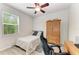 Bedroom with a bed, wood dresser, ceiling fan, and great lighting at 10708 52Nd E Ct, Parrish, FL 34219