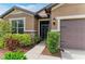 Close up of the front entrance showing stone accents and lush greenery at 10708 52Nd E Ct, Parrish, FL 34219
