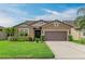 Charming single-Gathering home with attached two-car garage and manicured landscape at 10708 52Nd E Ct, Parrish, FL 34219