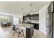 Modern kitchen island with granite countertops and seating at 10708 52Nd E Ct, Parrish, FL 34219