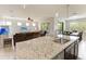 Spacious kitchen with a center island and view to the living room and dining areas at 10708 52Nd E Ct, Parrish, FL 34219