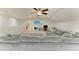 Spacious living room featuring a large sectional, TV, and built-in storage at 10708 52Nd E Ct, Parrish, FL 34219