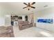 Open-concept living area with tile floors and views of the kitchen at 10708 52Nd E Ct, Parrish, FL 34219