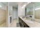 Main bathroom with dual sinks, granite countertops, and tile flooring and shower at 10708 52Nd E Ct, Parrish, FL 34219