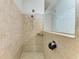 Walk-in shower with tile surround, glass partition and dual shower heads at 10708 52Nd E Ct, Parrish, FL 34219