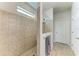 Shower with decorative tile and rain shower head in the main bathroom at 10708 52Nd E Ct, Parrish, FL 34219