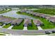 Aerial view of the home showcasing a lake view and well-maintained landscaping at 10724 Spring Tide Way, Parrish, FL 34219