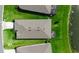 Aerial shot of the home featuring the roof, surrounding lawn, and an adjacent lake at 10724 Spring Tide Way, Parrish, FL 34219