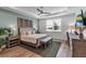 Inviting bedroom with a comfortable bed, decorative wall art, and ample natural light from the window, creating a serene retreat at 10724 Spring Tide Way, Parrish, FL 34219