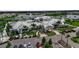 Aerial view of community clubhouse, showcasing amenities and tropical landscaping at 10724 Spring Tide Way, Parrish, FL 34219