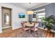 Inviting dining area with a round table, stylish chairs, and natural light from a nearby window at 10724 Spring Tide Way, Parrish, FL 34219