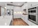 Bright modern kitchen with stainless steel appliances, beautiful countertops and custom cabinets at 10724 Spring Tide Way, Parrish, FL 34219