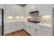 Modern kitchen design features ample countertop space, sleek cabinetry, and stainless steel appliances at 10724 Spring Tide Way, Parrish, FL 34219